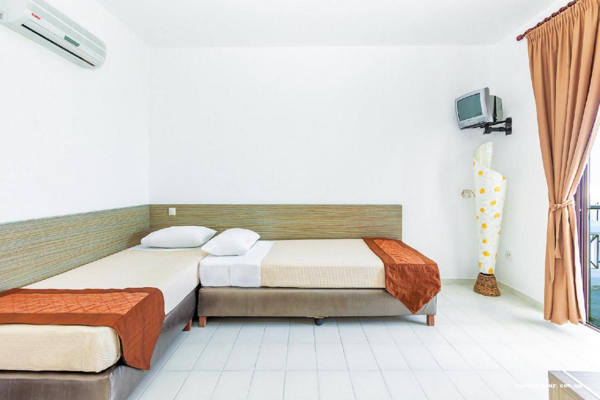 Xenios Dolphin Beach (Ex. Dolphin Beach) інформація про готель та пошук турів в готелі Xenios Dolphin Beach (Ex. Dolphin Beach) в Греції